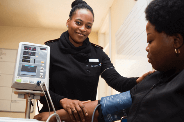 Woman having blood pressure monitor
